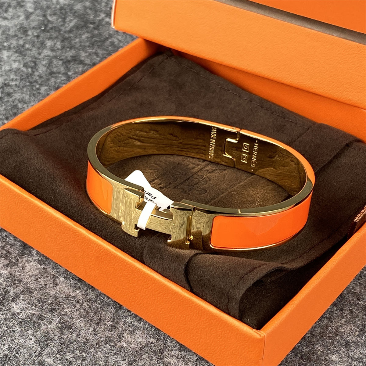 Narrow Clic Clac H Bracelet – Gold-Tone & Orange Enamel  display picture 1