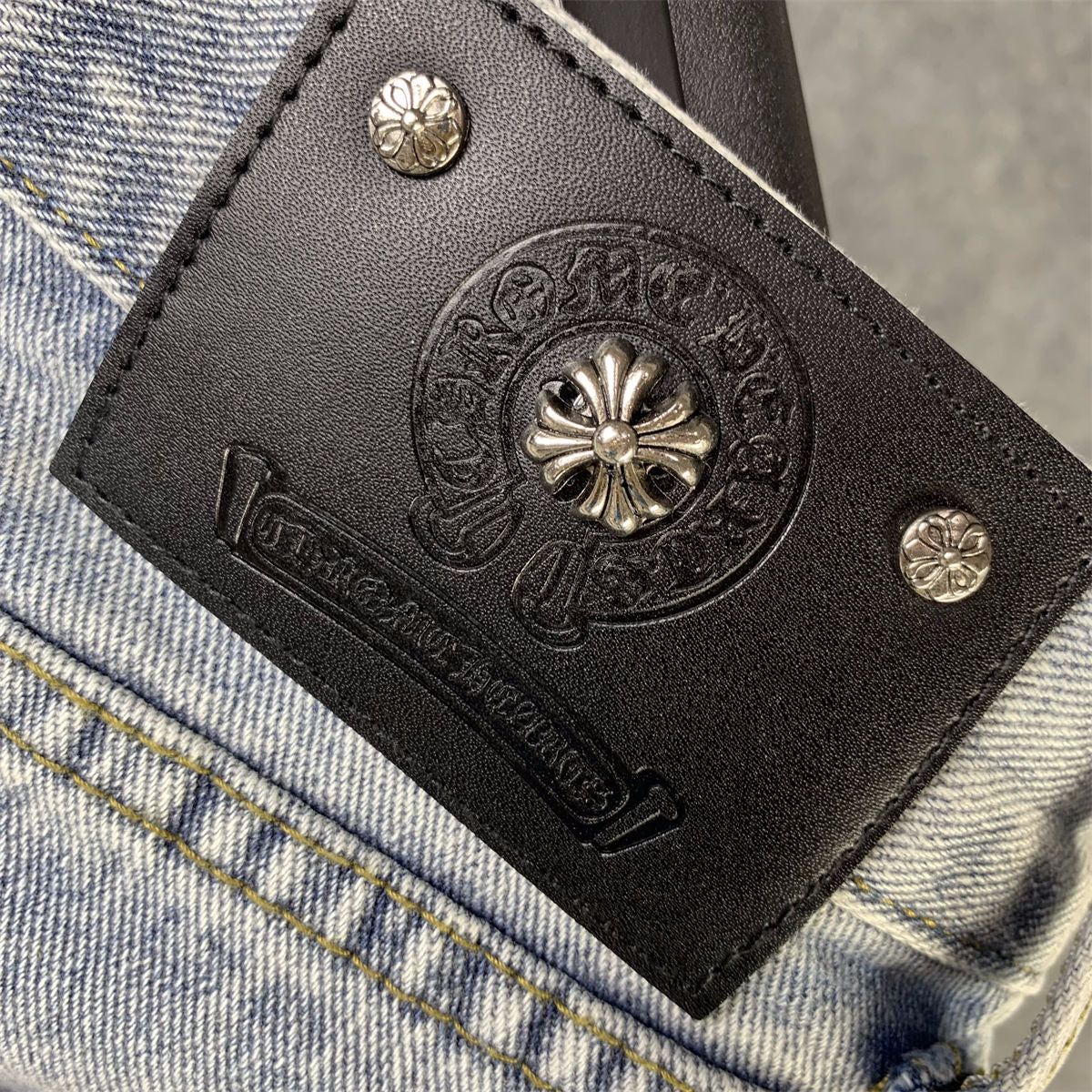 CHROME HEARTS Blue Jeans With Black Leather Crosses