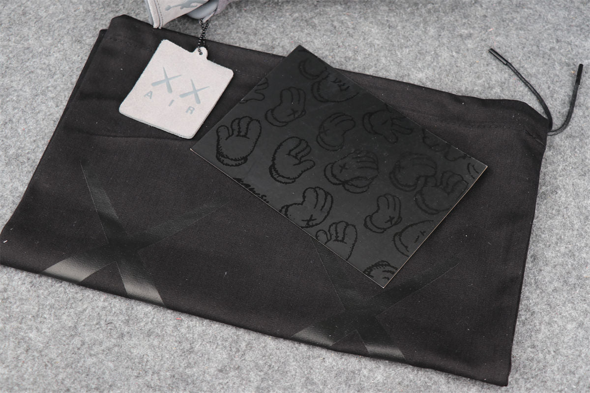 KAWS x Air Jordan 4 Retro 'Cool Grey' Sample